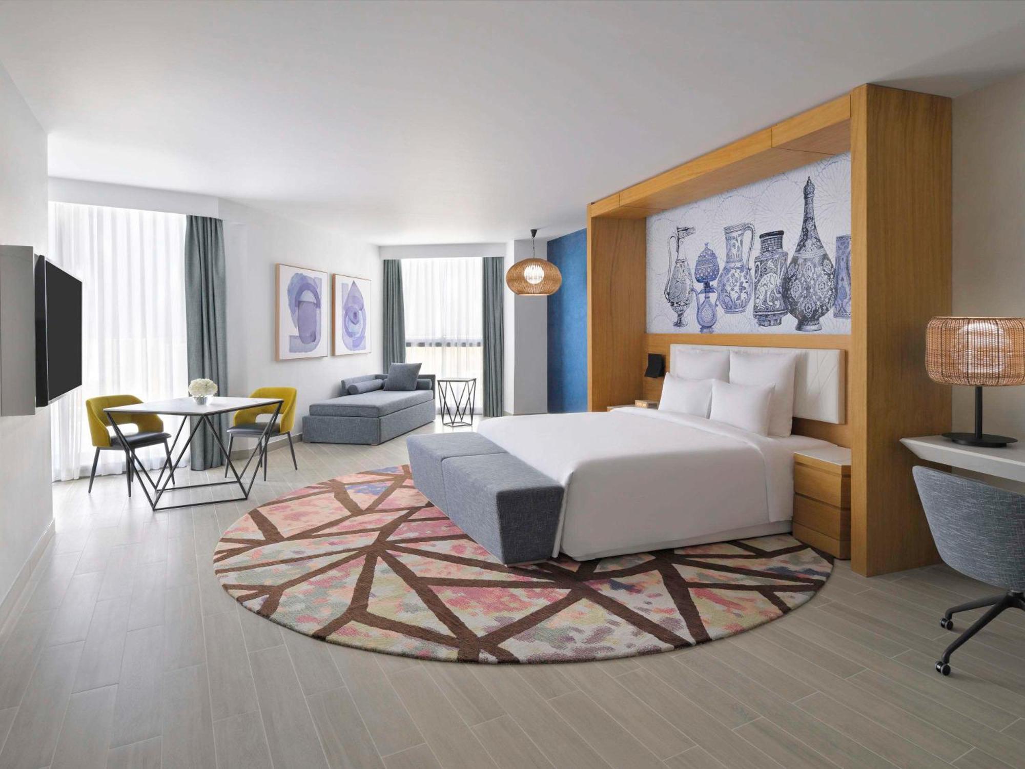 Moevenpick Hotel & Apartments Ghala Muskat Bagian luar foto A room at the hotel