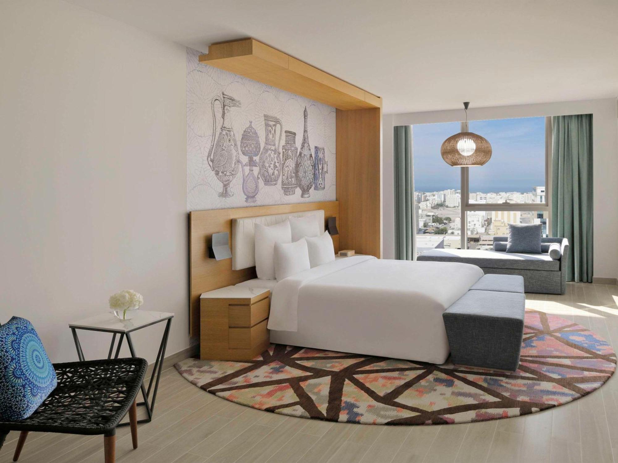 Moevenpick Hotel & Apartments Ghala Muskat Bagian luar foto Deluxe room